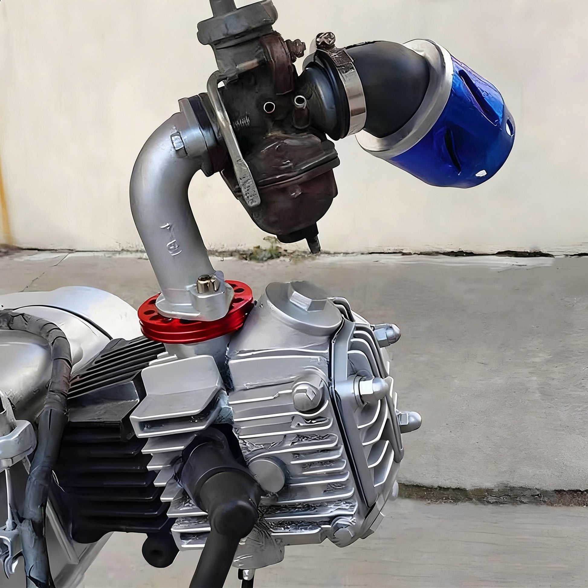 universal CNC intake pipe adapter plate installed on a motorcycle engine for carburetor adjustment and performance tuning