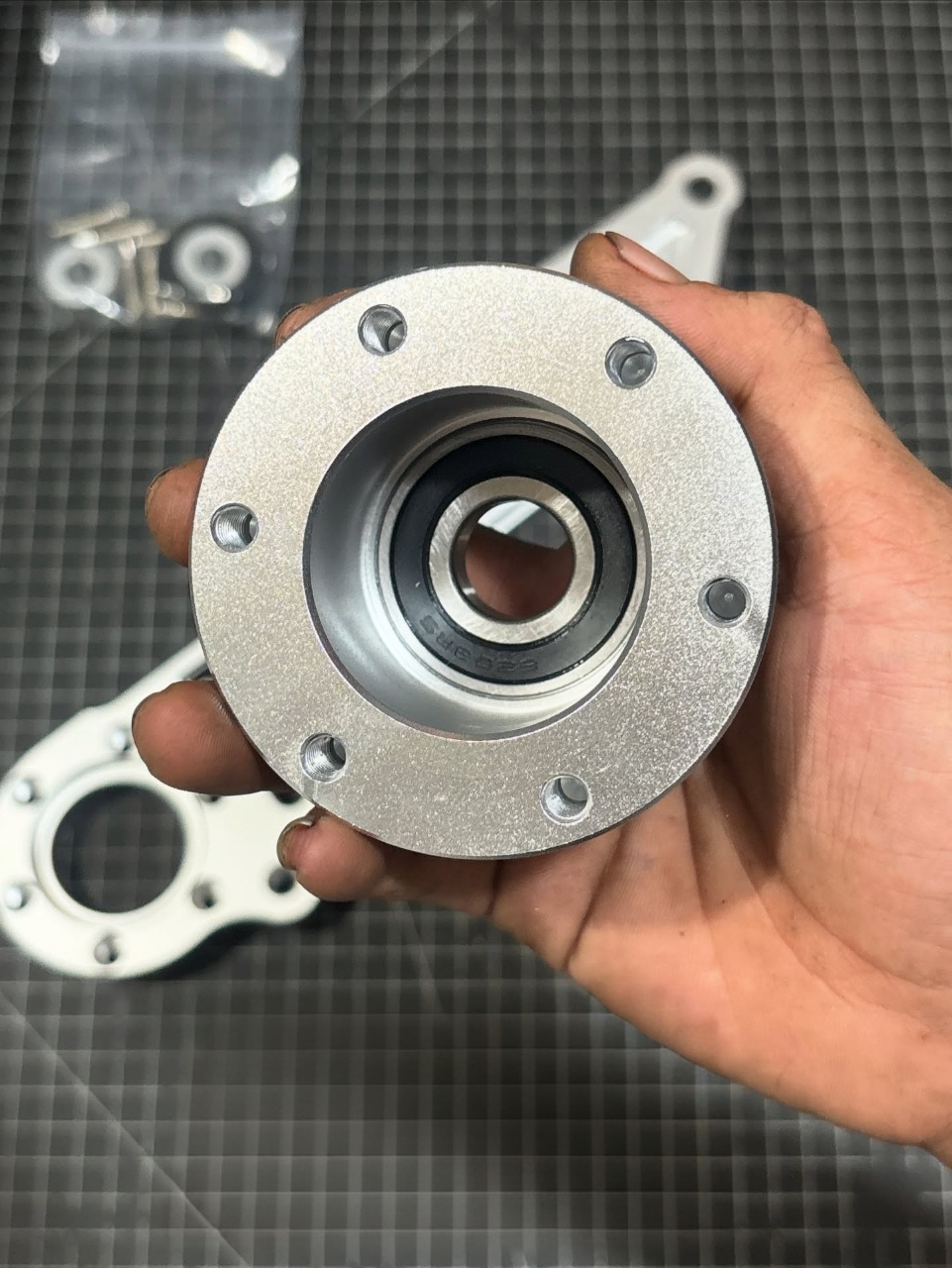 Close-up of CNC precision machining process - Motorcycle engine parts