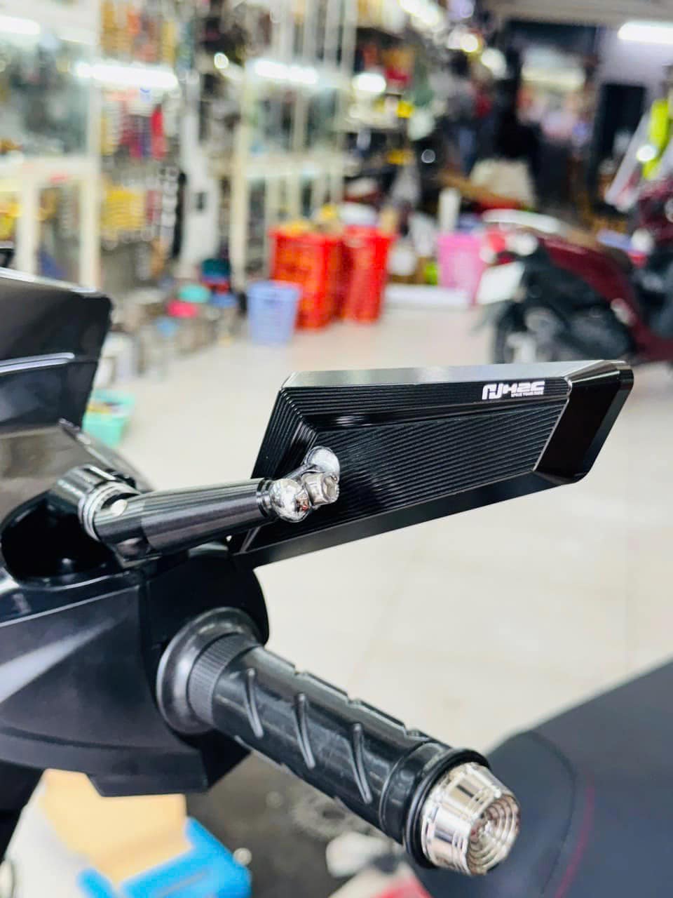 H2C rearview mirror in action on a motorcycle enhancing rider safety