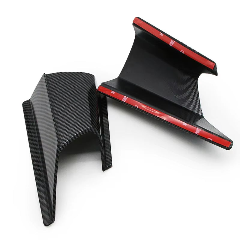 Close-up details of the carbon fiber spoiler highlight the material texture and workmanship quality.
